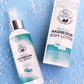 Close up of pure magnesium oil spray and lotion bottles on a textured blue surface. Infused with Dead Sea magnesium chloride, they promote skin nourishment and muscle recovery.