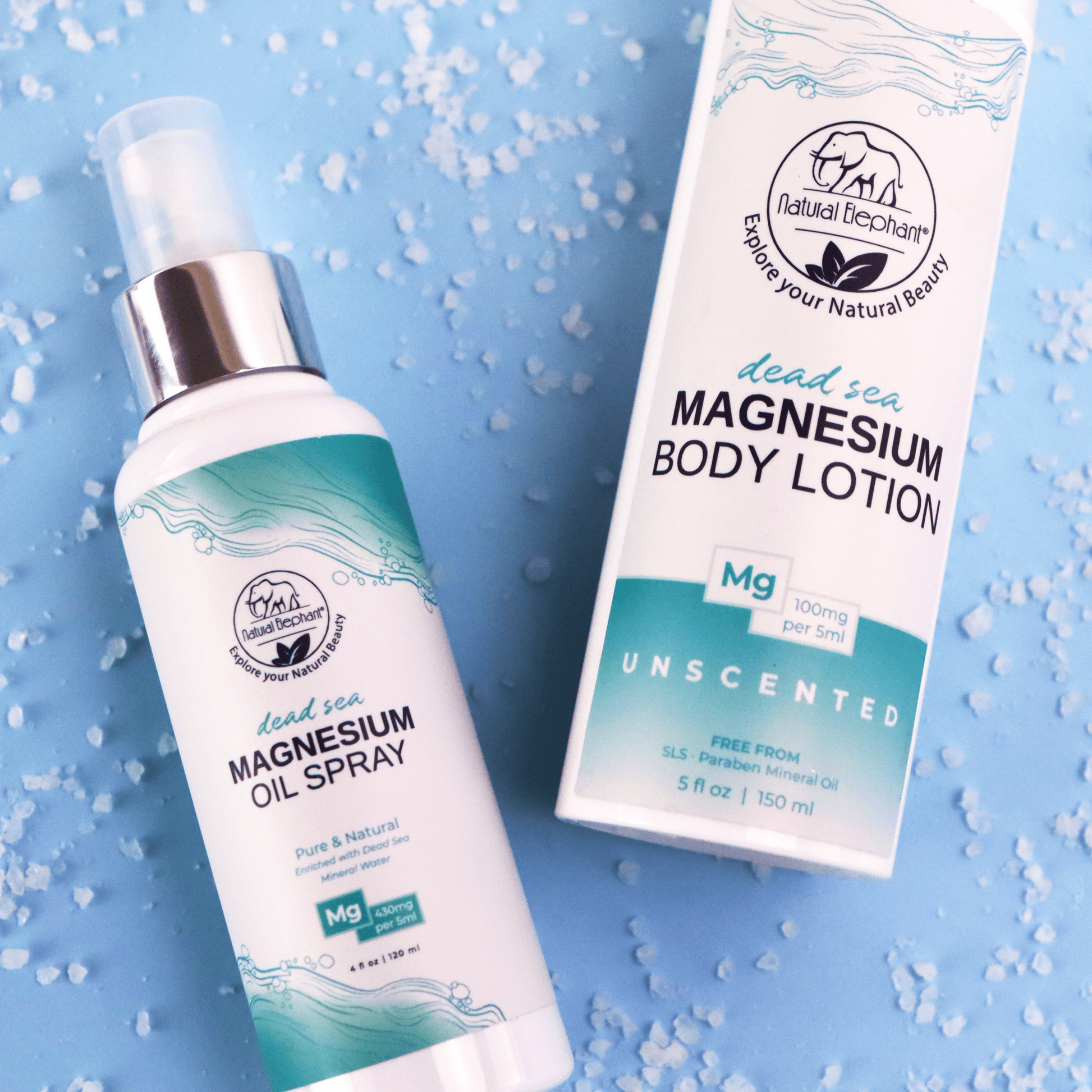Close up of pure magnesium oil spray and lotion bottles on a textured blue surface. Infused with Dead Sea magnesium chloride, they promote skin nourishment and muscle recovery.